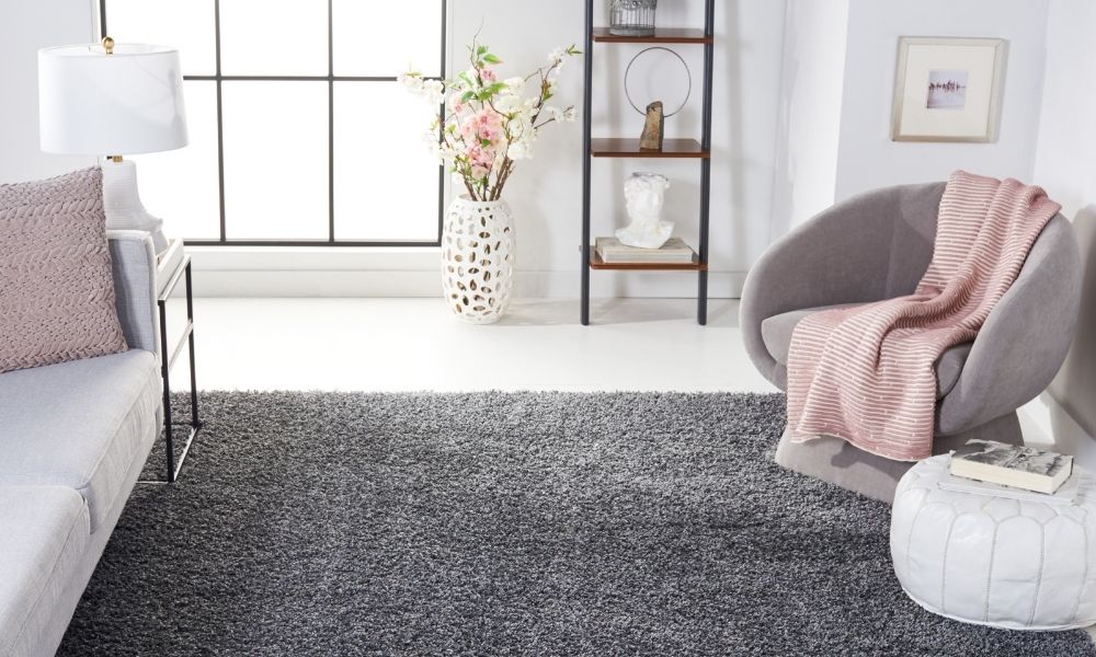 4 Decorating Tips for Using Area Rugs Over Carpet