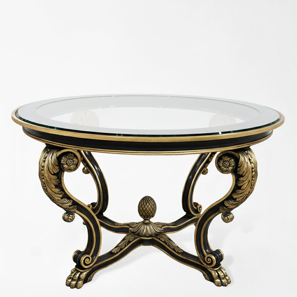 Ornate wood and gold center table with glass top.