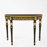 Traditional black console table with intricate gold details.