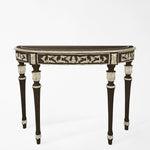 Traditional black console table with intricate silver details.