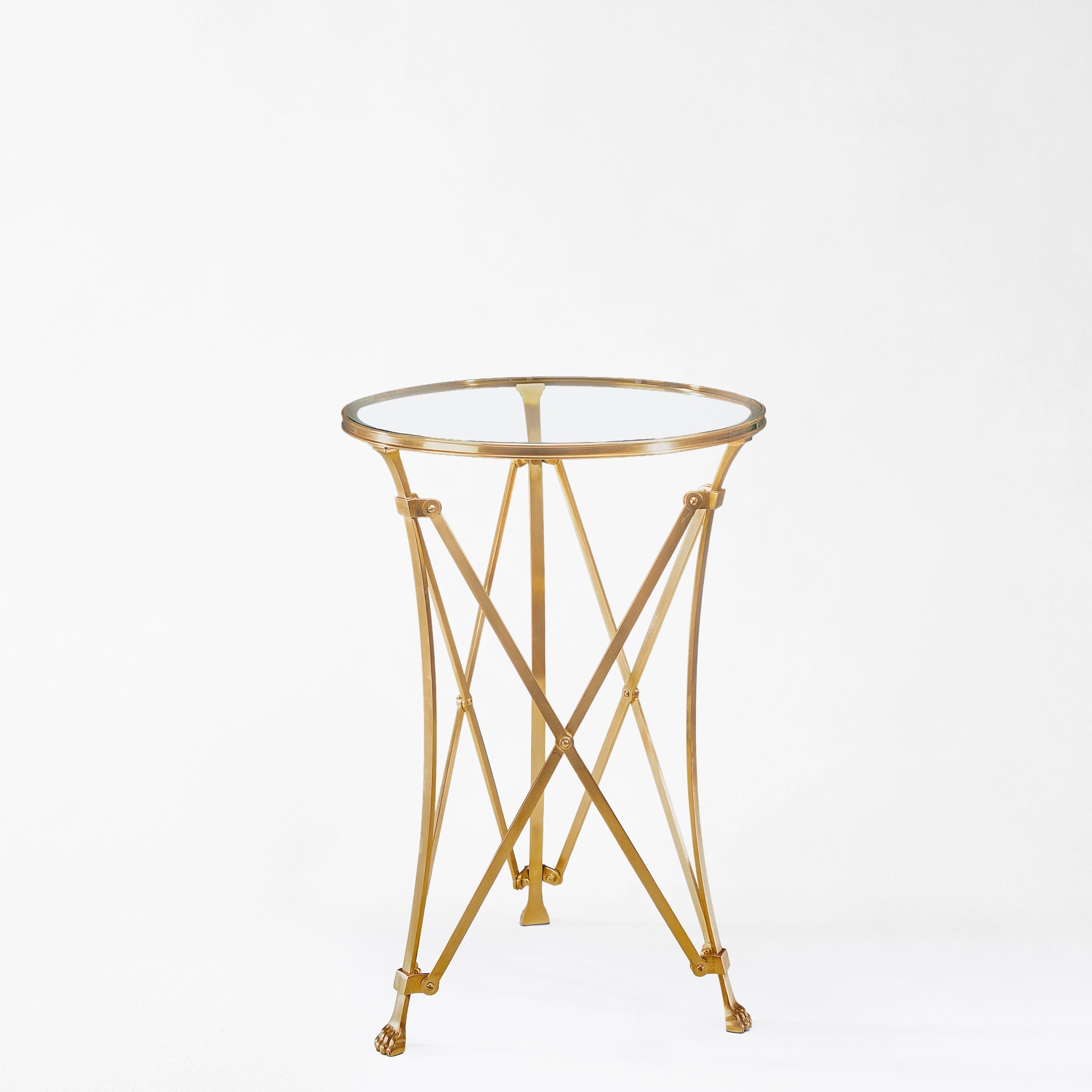 Brass gueridon table with glass top.