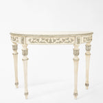 Traditional Italian white console table with carved silver leaf details.