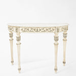White and silver console table with white marble top.